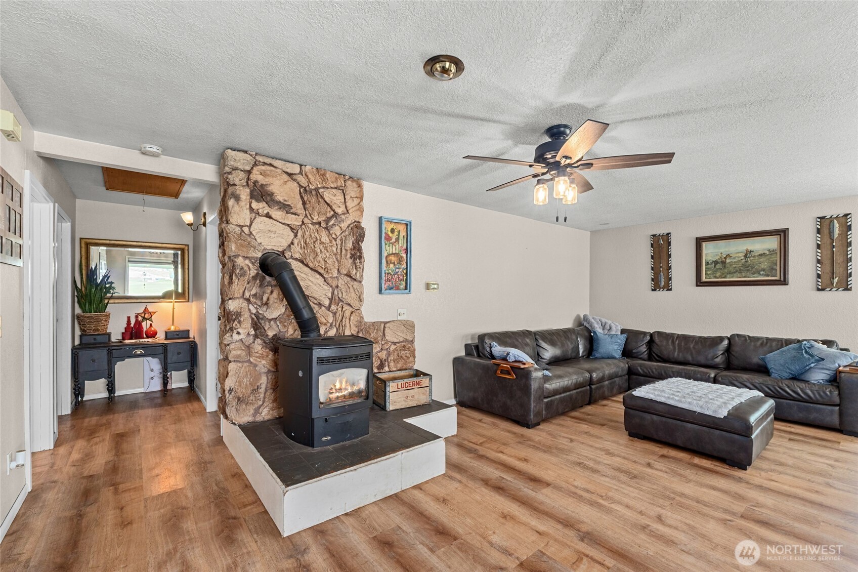 93 Warren Road Tonasket, WA 98855 - Photo 9 of 31 a living room with furniture and a wooden floor