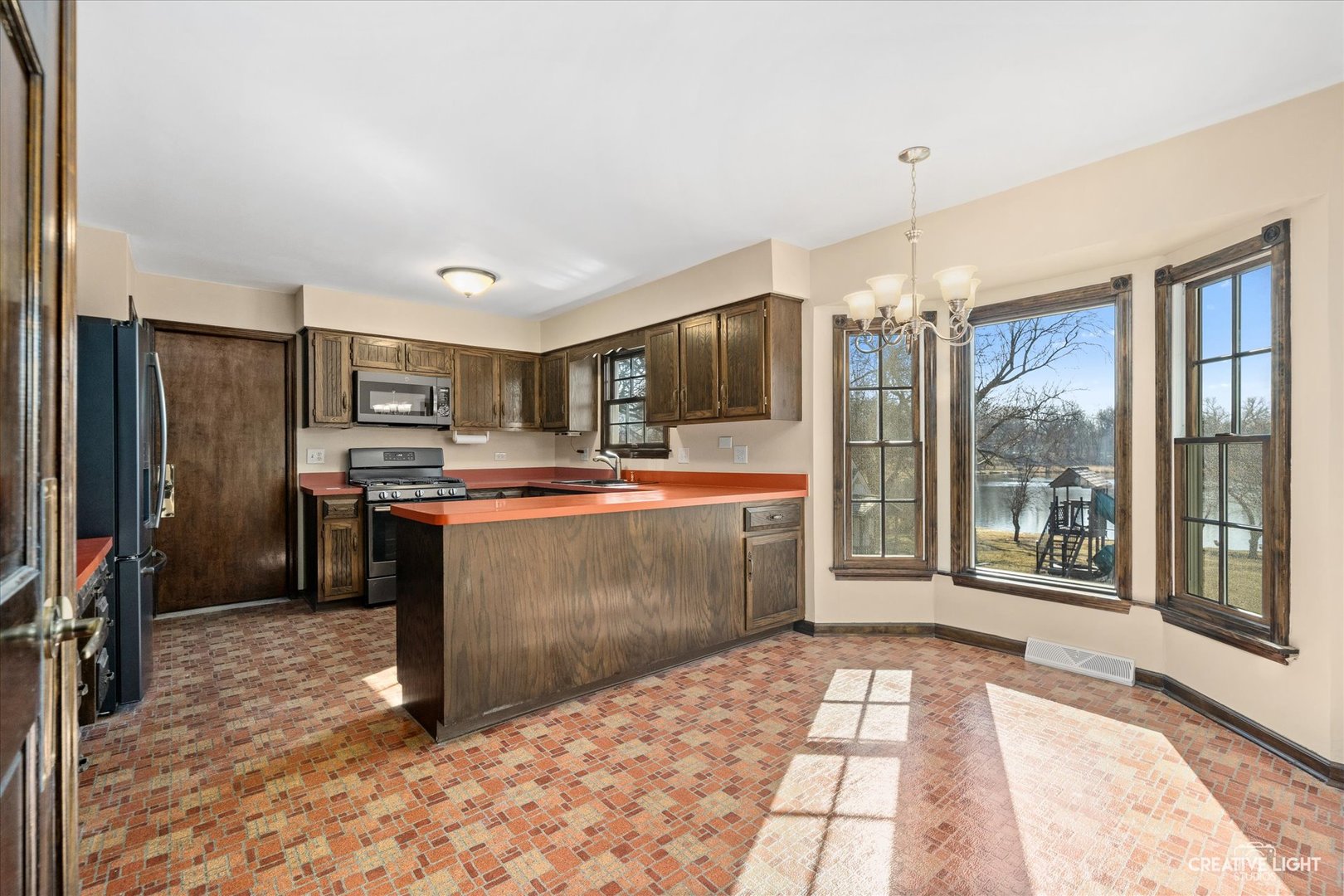 43W501 Scott Road Sugar Grove, IL 60554 - Photo 5 of 42 a kitchen with stainless steel appliances kitchen island granite countertop a refrigerator and a sink