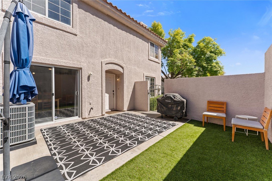 503 Rafkin Place Henderson, NV 89052 - Photo 7 of 18 A private outdoor space with artificial turf and a covered patio for relaxed entertaining.