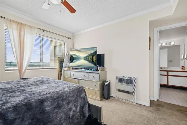 a bedroom with a bed and a cabinets