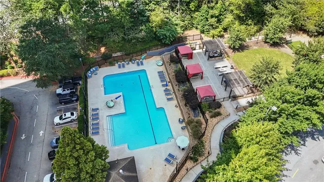 an aerial view of residential house with outdoor space and parking