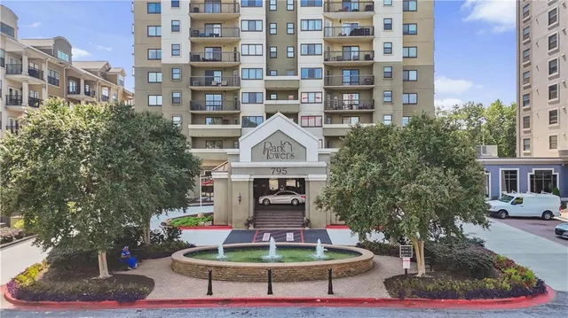 a front view of a building with garden