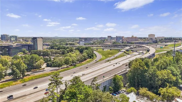 a view of a city with lawn chairs