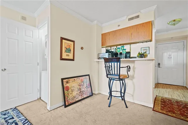 a view of a hallway with workspace and mirror