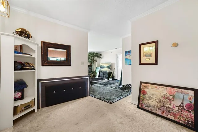 a living room with furniture and painting on the wall