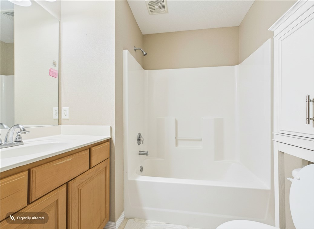 1000 Spring Loop, Unit 2103 College Station, TX 77840 - Photo 22 of 28 a bathroom with a bathtub and a sink