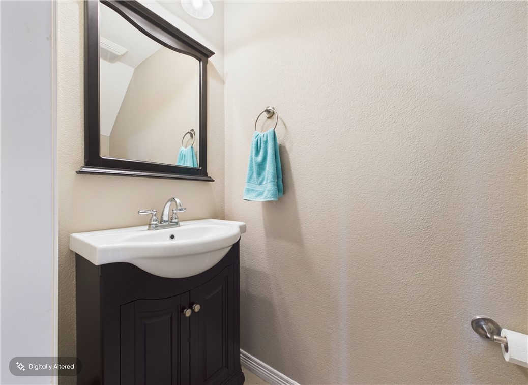 1000 Spring Loop, Unit 2103 College Station, TX 77840 - Photo 10 of 28 a bathroom with a sink and a mirror