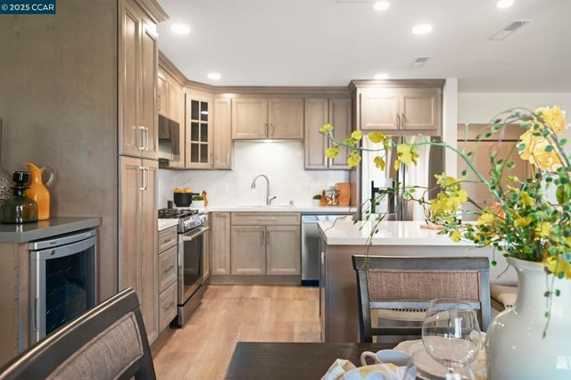 a kitchen with a sink stove and refrigerator