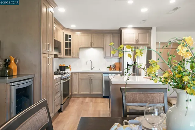 a kitchen with a sink stove and refrigerator