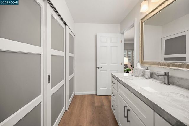 a bathroom with a double vanity sink and mirror