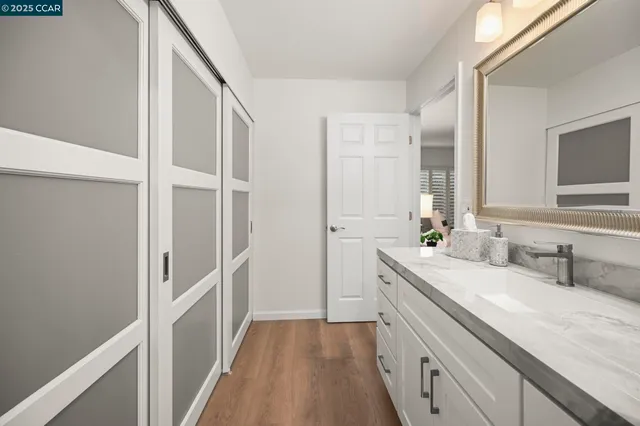 a bathroom with a double vanity sink and mirror
