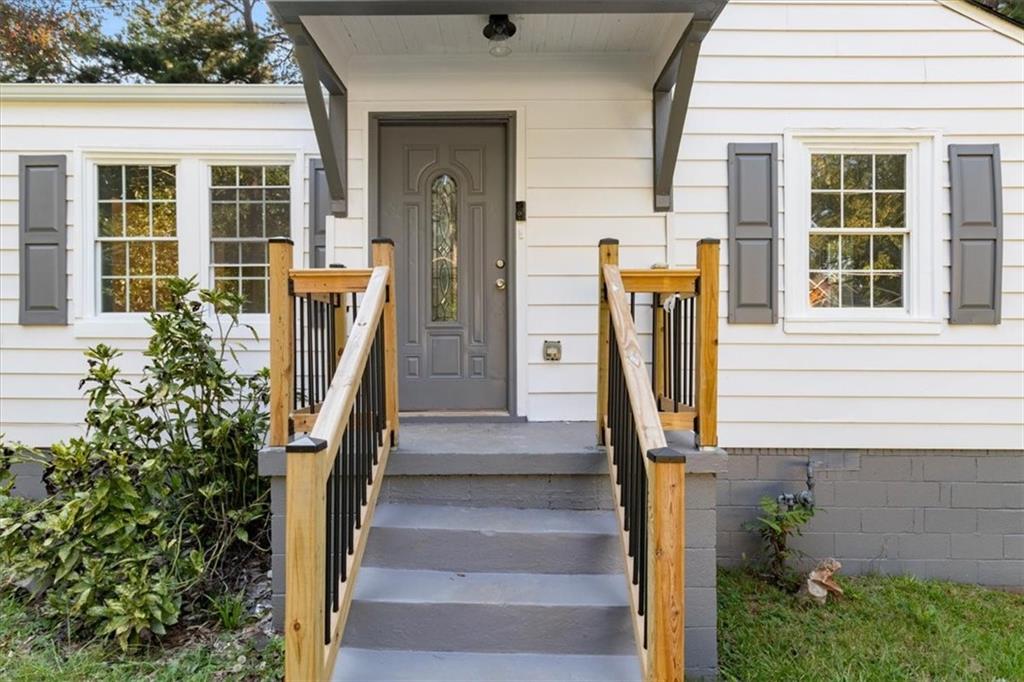 1347 Westmont Road Southwest Atlanta, GA 30311 - Photo 2 of 26 a front view of a house with stairs