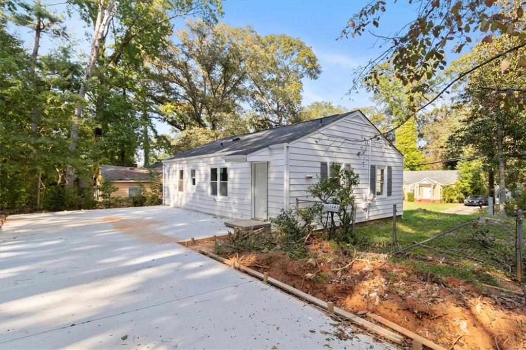 1347 Westmont Road Southwest Atlanta, GA 30311 - Photo 23 of 26 a front view of a house with garden