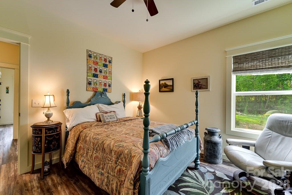190 Fort Hembree Road Hayesville, NC 28904 - Photo 14 of 18 a bed room with a bed window and a table