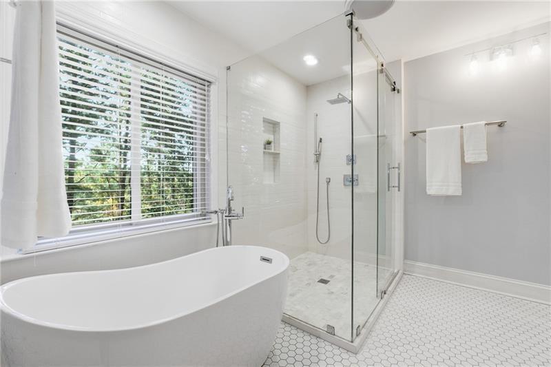 3655 East Paces Walk Atlanta, GA 30326 - Photo 15 of 31 a white bath tub sitting next to a shower