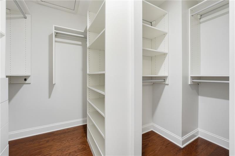 3655 East Paces Walk Atlanta, GA 30326 - Photo 16 of 31 a view of walk in closet with empty racks