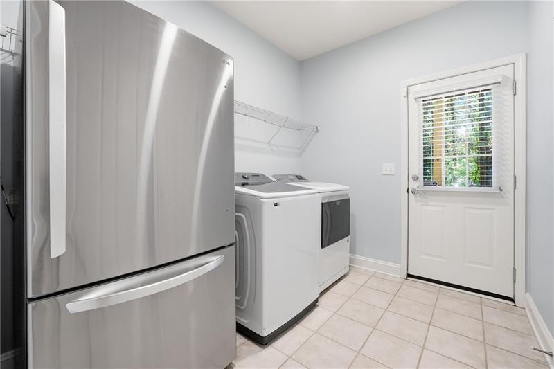 3655 East Paces Walk Atlanta, GA 30326 - Photo 18 of 31 a utility room with dryer and washer