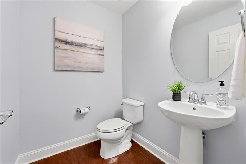 3655 East Paces Walk Atlanta, GA 30326 - Photo 20 of 31 a bathroom with a sink toilet and a mirror