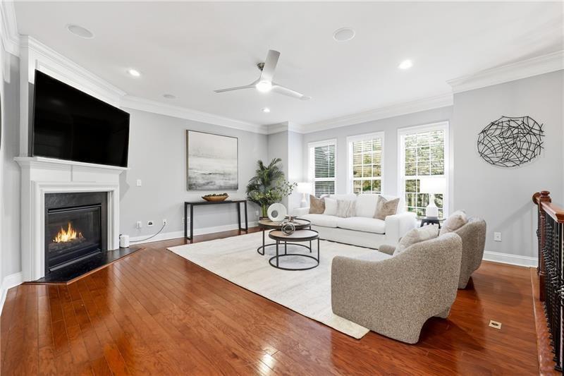 3655 East Paces Walk Atlanta, GA 30326 - Photo 2 of 31 a living room with fireplace furniture and a flat screen tv