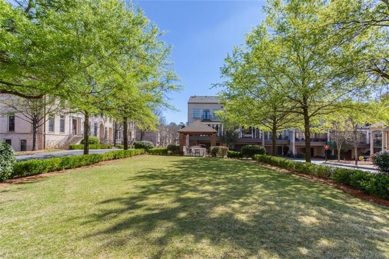 3655 East Paces Walk Atlanta, GA 30326 - Photo 27 of 31 a house with trees in front of it