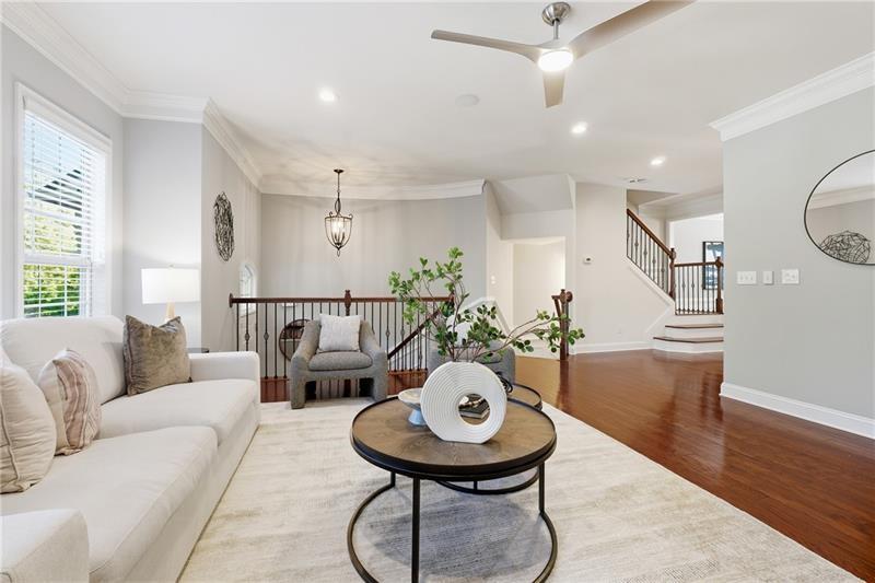 3655 East Paces Walk Atlanta, GA 30326 - Photo 3 of 31 a living room with furniture and wooden floor