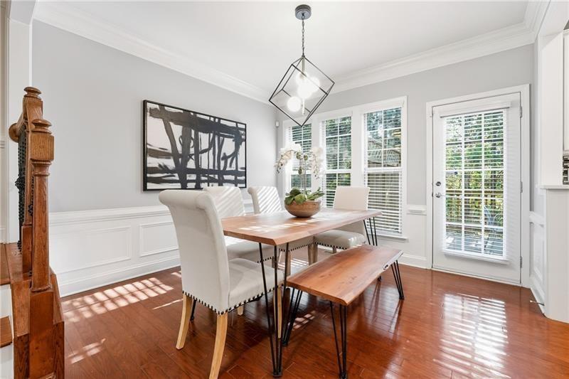 3655 East Paces Walk Atlanta, GA 30326 - Photo 4 of 31 a view of a dining room with furniture window and wooden floor