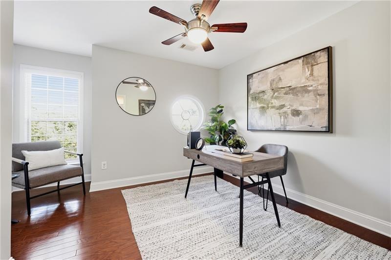 3655 East Paces Walk Atlanta, GA 30326 - Photo 9 of 31 a workspace with furniture and wooden floor