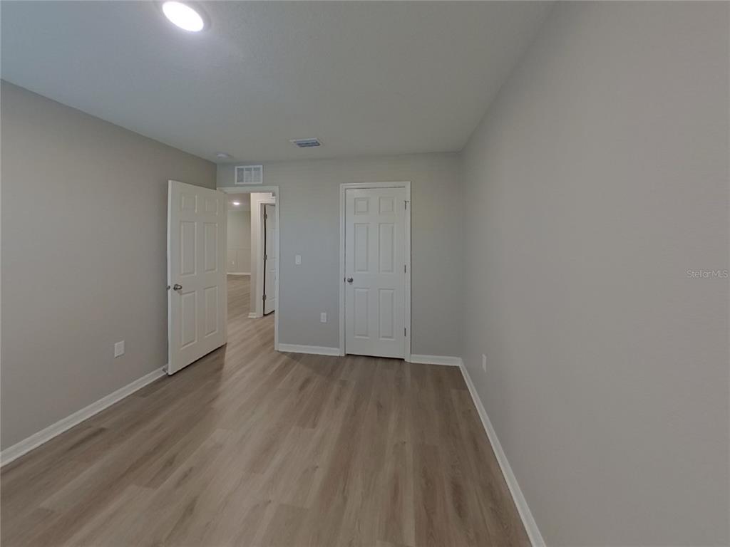 Undisclosed Address Apollo Beach, FL 33572 - Photo 15 of 20 a view of an empty room with wooden floor