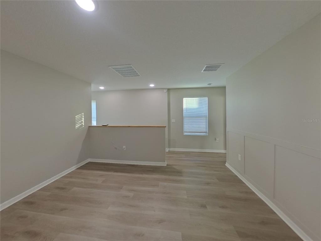 Undisclosed Address Apollo Beach, FL 33572 - Photo 19 of 20 an empty room with windows and entrance to other room