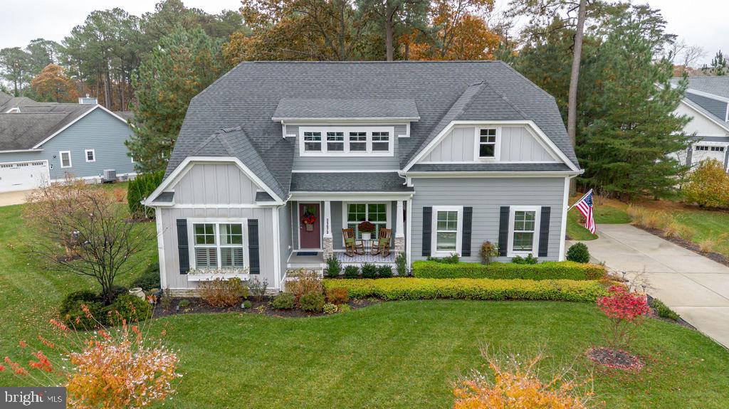 31673 Sloan Cove Road Lewes, DE 19958 - Photo 1 of 38 a front view of a house with a garden