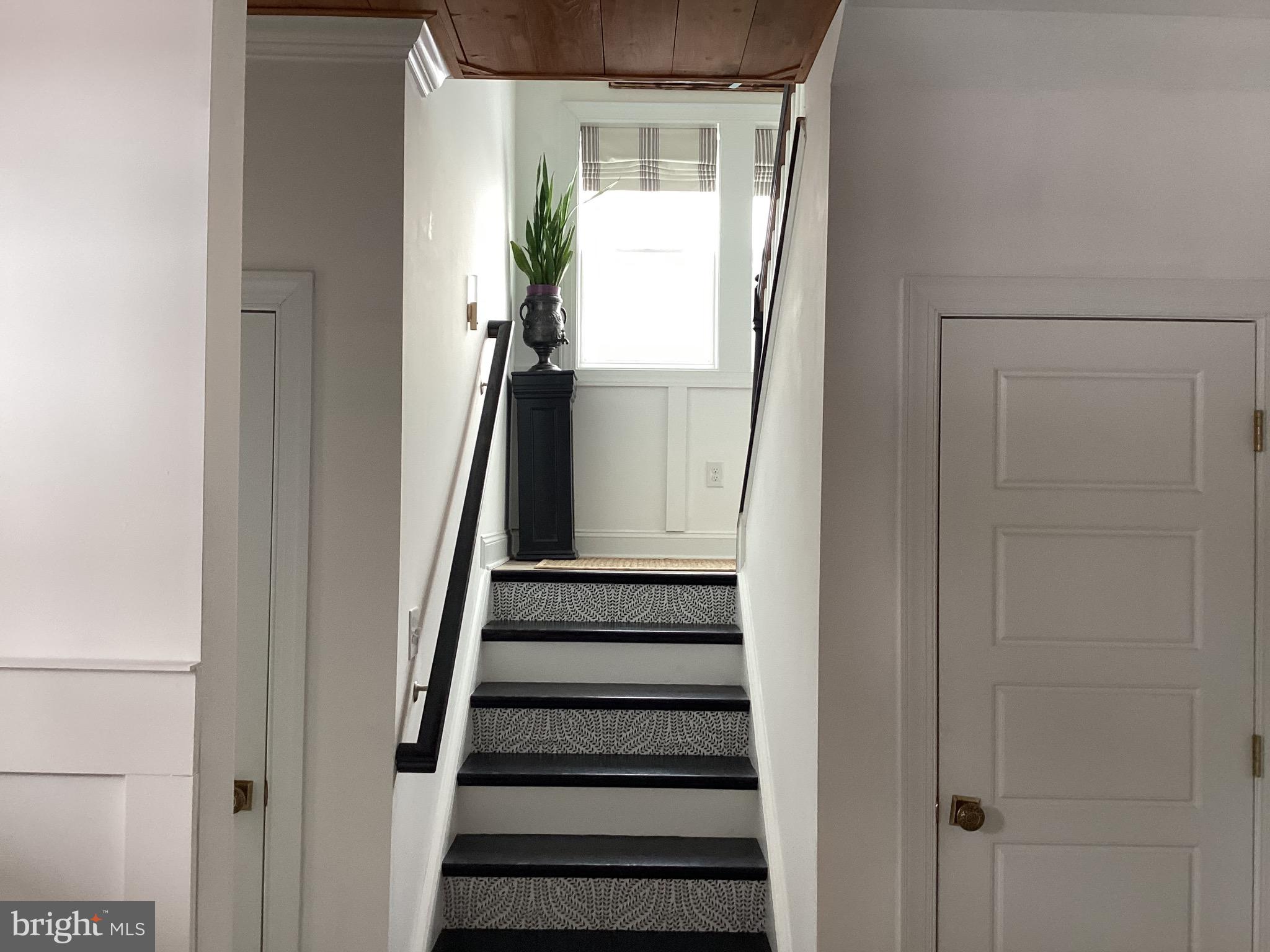 31673 Sloan Cove Road Lewes, DE 19958 - Photo 20 of 38 a view of entryway with wooden floor and stairs