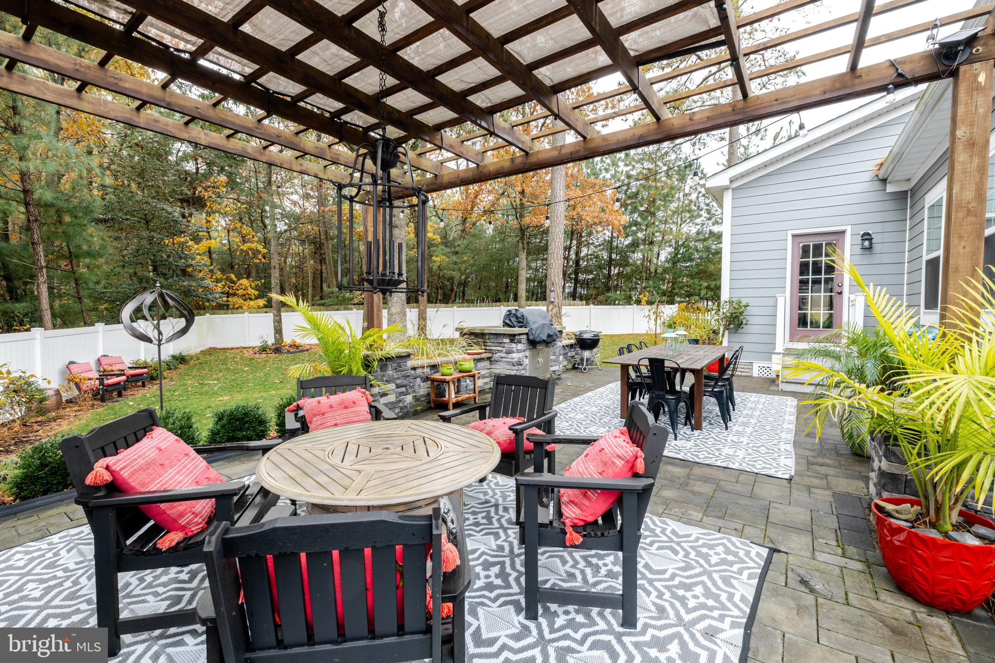 31673 Sloan Cove Road Lewes, DE 19958 - Photo 27 of 38 a view of a tables and chairs in patio