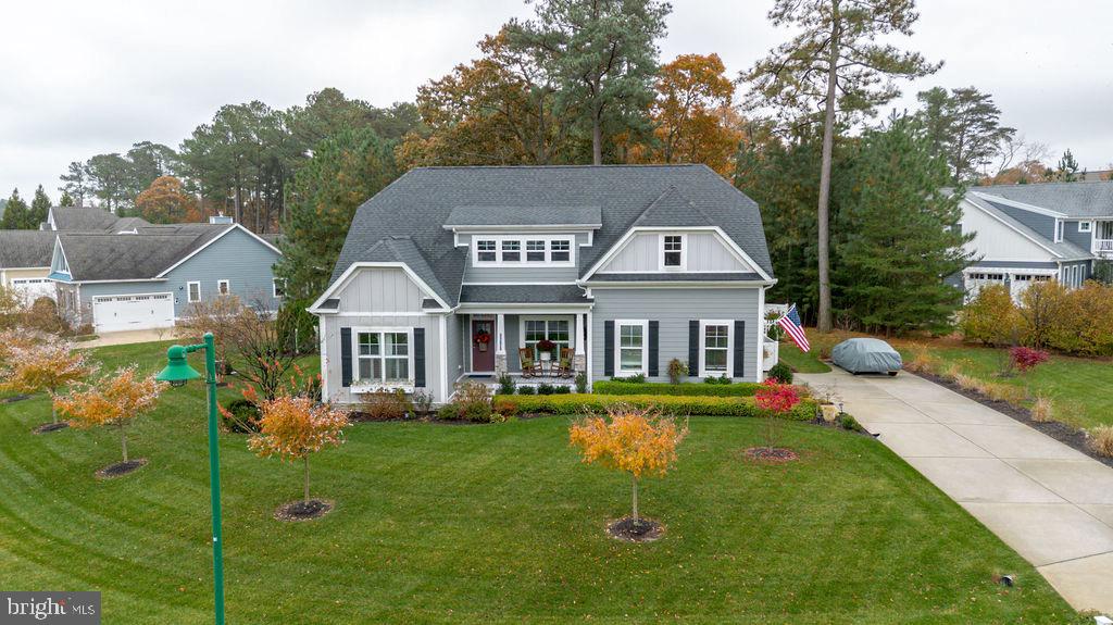 31673 Sloan Cove Road Lewes, DE 19958 - Photo 31 of 38 a front view of a house with a garden