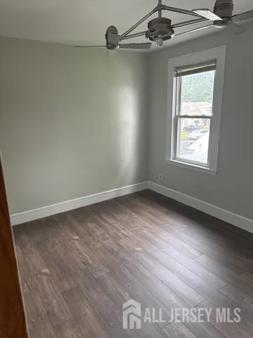 a room with a chair and a window