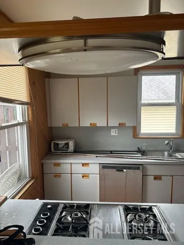 a view of a kitchen from the hallway