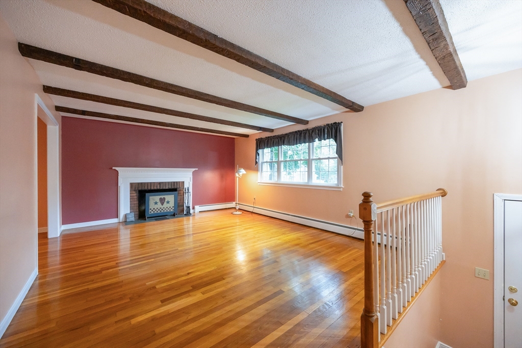 6 Clearview Drive Milford, MA 01757 - Photo 12 of 42 a view of an empty room with wooden floor and a window