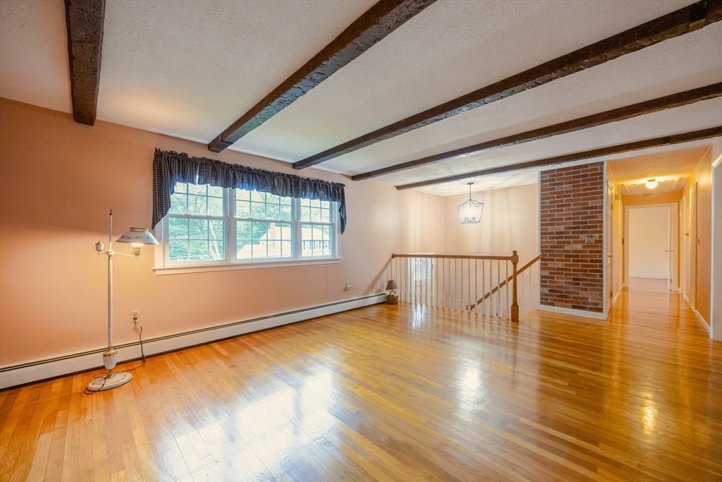 6 Clearview Drive Milford, MA 01757 - Photo 13 of 42 a view of an empty room with wooden floor and a window