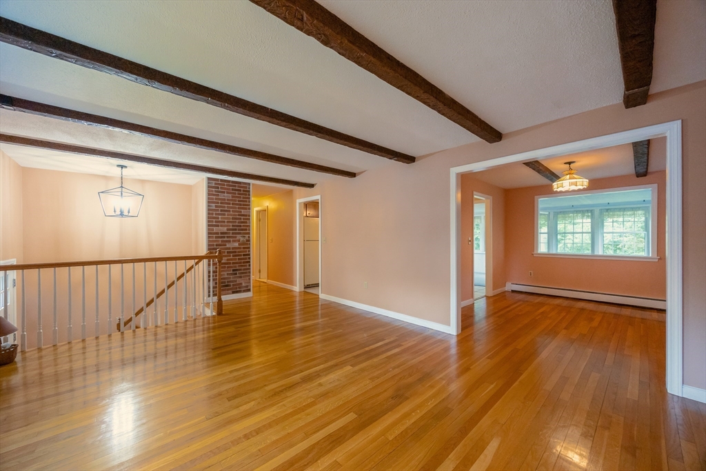 6 Clearview Drive Milford, MA 01757 - Photo 14 of 42 a view of an empty room with wooden floor and a window