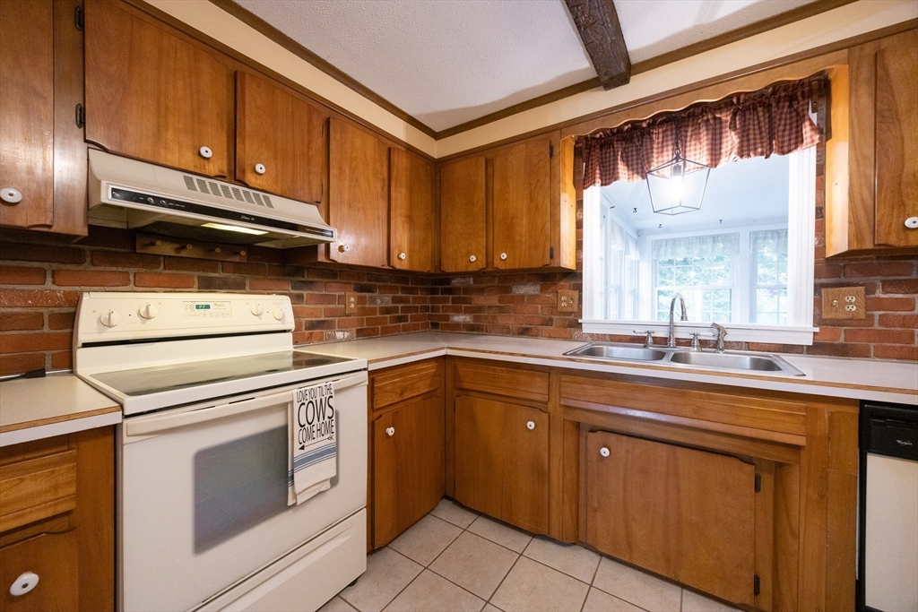 6 Clearview Drive Milford, MA 01757 - Photo 16 of 42 a kitchen with a sink cabinets appliances and a window