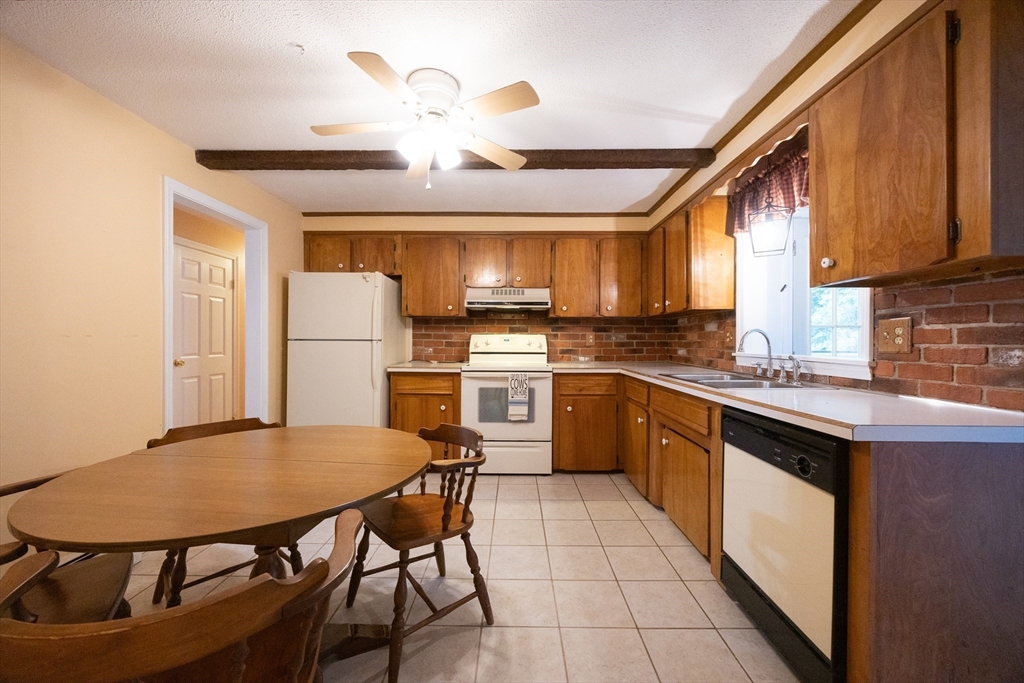 6 Clearview Drive Milford, MA 01757 - Photo 17 of 42 a kitchen with cabinets appliances and a dining table