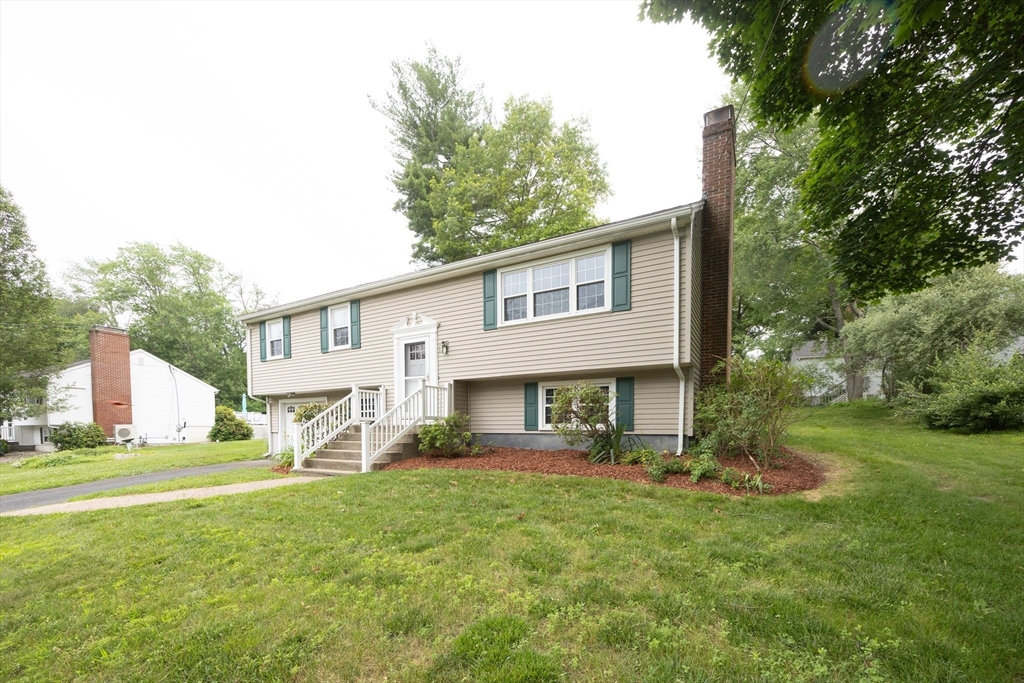 6 Clearview Drive Milford, MA 01757 - Photo 2 of 42 a view of a house with a yard and sitting area