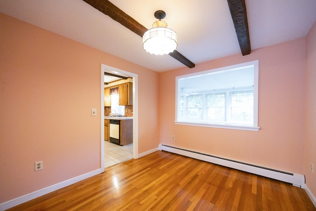 6 Clearview Drive Milford, MA 01757 - Photo 21 of 42 a view of an empty room with wooden floor and a window