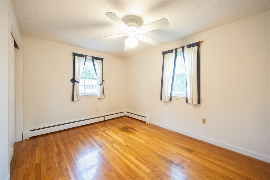 6 Clearview Drive Milford, MA 01757 - Photo 27 of 42 wooden floor in an empty room with a window