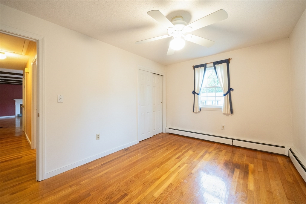6 Clearview Drive Milford, MA 01757 - Photo 28 of 42 wooden floor in an empty room with a window