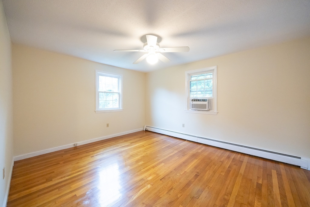 6 Clearview Drive Milford, MA 01757 - Photo 29 of 42 wooden floor in an empty room with a window