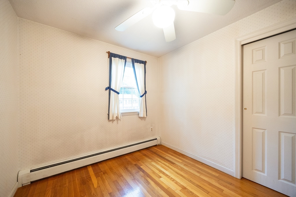 6 Clearview Drive Milford, MA 01757 - Photo 30 of 42 an empty room with wooden floor and windows