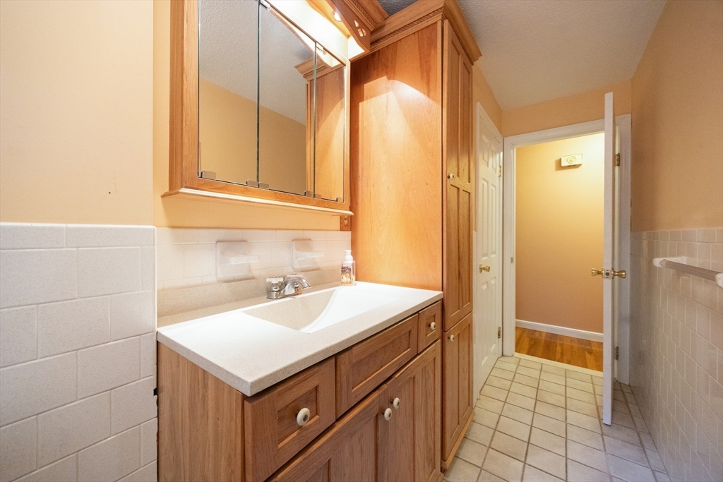 6 Clearview Drive Milford, MA 01757 - Photo 34 of 42 a bathroom with a sink and a mirror
