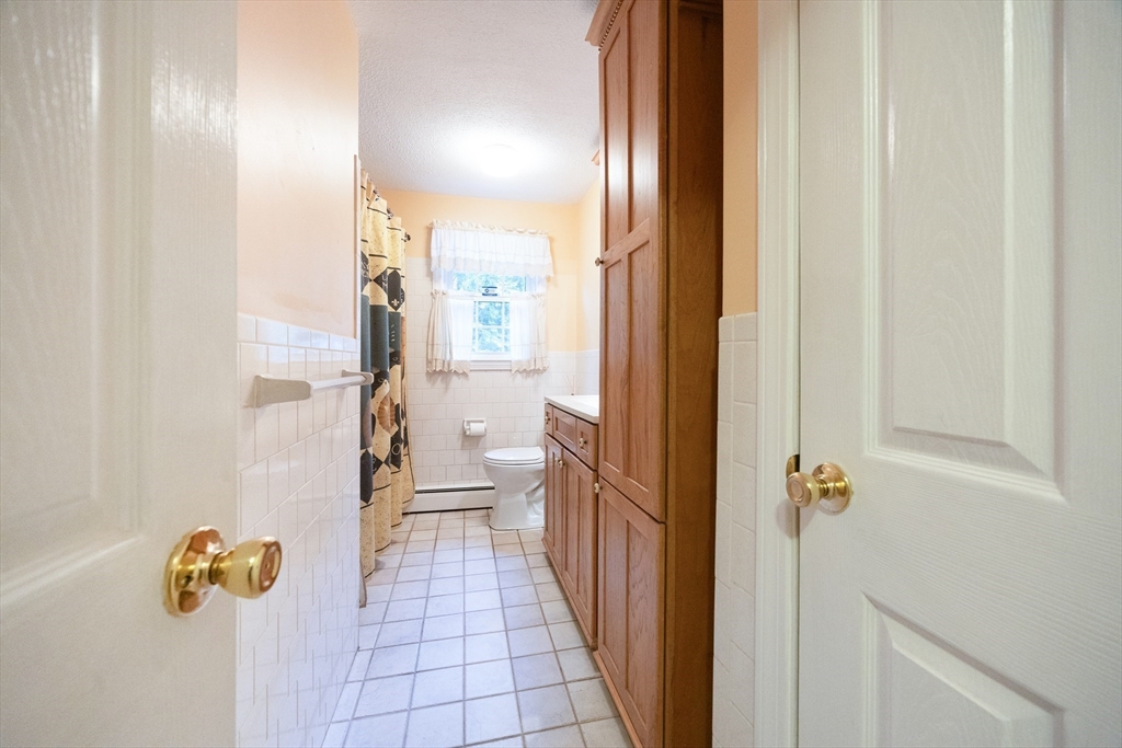 6 Clearview Drive Milford, MA 01757 - Photo 35 of 42 a bathroom with a bathtub and shower