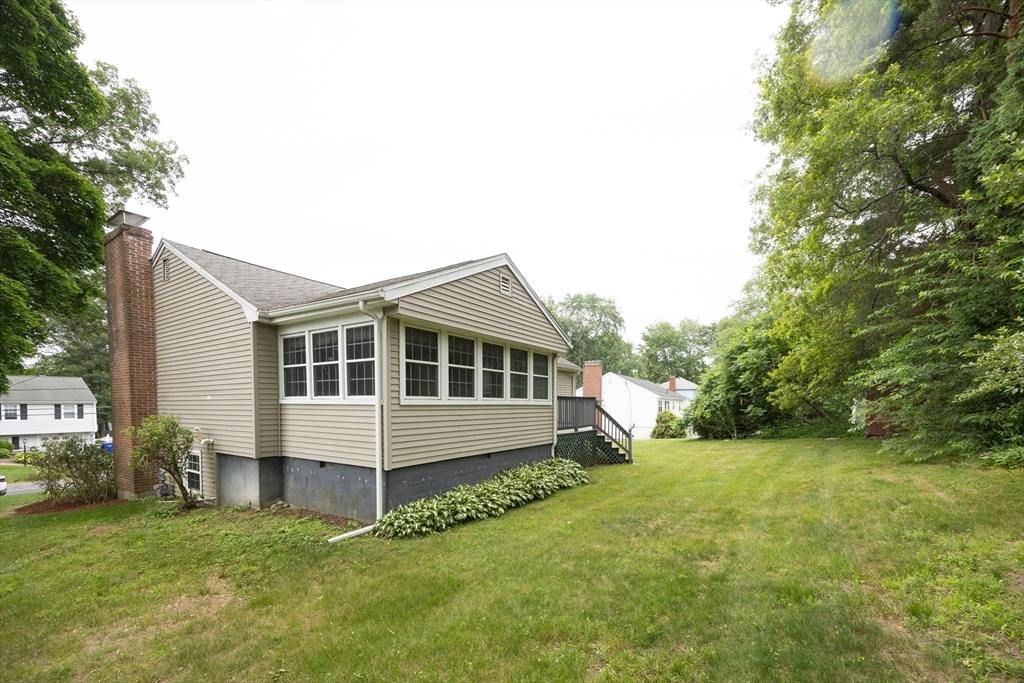 6 Clearview Drive Milford, MA 01757 - Photo 6 of 42 a front view of a house with a yard
