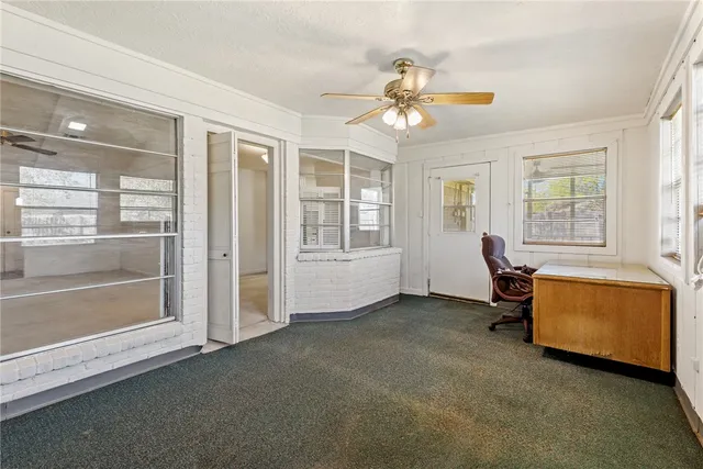 a view of a livingroom with furniture